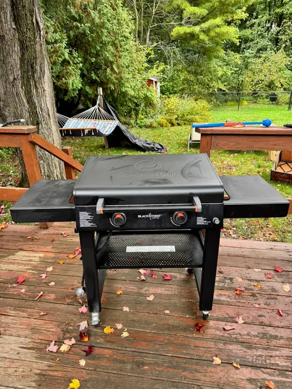 Blackstone 28" Griddle with Hood, $200 (retails ~$399)

Well cared for and ready for the season. The cooktop was cleaned after every use, both burners fire up clean, and there are no ignition issues or dead burners.

What you get:

Blackstone 28" 2-burner griddle with hood
Weather cover
Spatula and scraper tool set
Grease trap, side shelves, and bottom shelf, all present

Pickup: Local pickup in South Burlington. It's heavy, but it rolls, and it fits in an SUV with the legs folded.

Half the price of new, with the cover and tools already included.