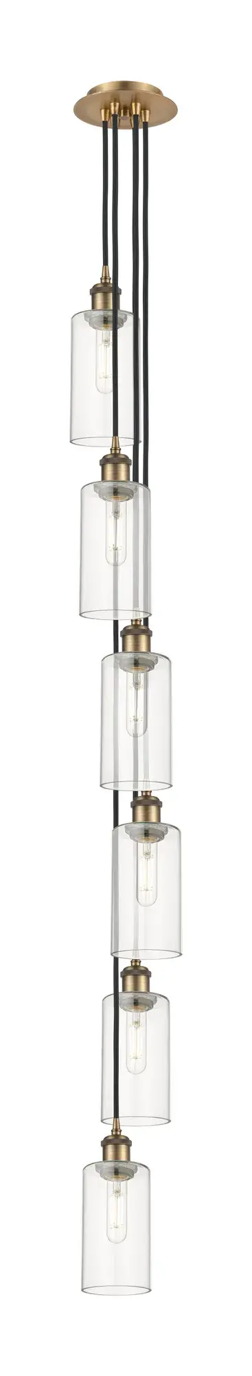 The organic teardrop shape of the Crown Point pendant is artfully hung from a tiered metal frame that is complemented by a single filament bulb.  These pendants look great as individual fixtures but make a grand statement when paired with our multi-port hanging system as part of our custom cord program.