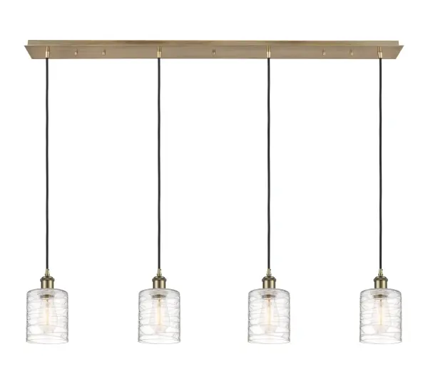 The organic teardrop shape of the Crown Point pendant is artfully hung from a tiered metal frame that is complemented by a single filament bulb. These pendants look great as individual fixtures but make a grand statement when paired with our multi-port hanging system as part of our custom cord program.