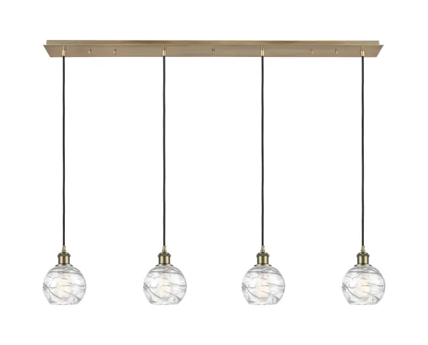 The organic teardrop shape of the Crown Point pendant is artfully hung from a tiered metal frame that is complemented by a single filament bulb. These pendants look great as individual fixtures but make a grand statement when paired with our multi-port hanging system as part of our custom cord program.