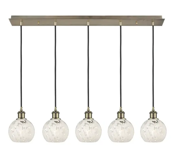 The organic teardrop shape of the Crown Point pendant is artfully hung from a tiered metal frame that is complemented by a single filament bulb. These pendants look great as individual fixtures but make a grand statement when paired with our multi-port hanging system as part of our custom cord program.