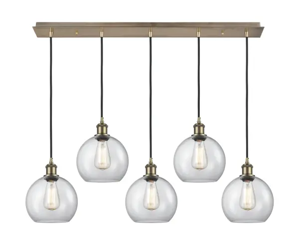 The organic teardrop shape of the Crown Point pendant is artfully hung from a tiered metal frame that is complemented by a single filament bulb. These pendants look great as individual fixtures but make a grand statement when paired with our multi-port hanging system as part of our custom cord program.