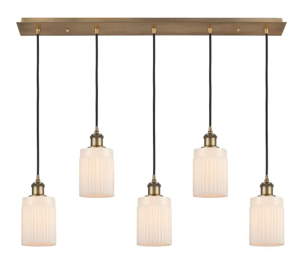 The organic teardrop shape of the Crown Point pendant is artfully hung from a tiered metal frame that is complemented by a single filament bulb. These pendants look great as individual fixtures but make a grand statement when paired with our multi-port hanging system as part of our custom cord program. - alternate view