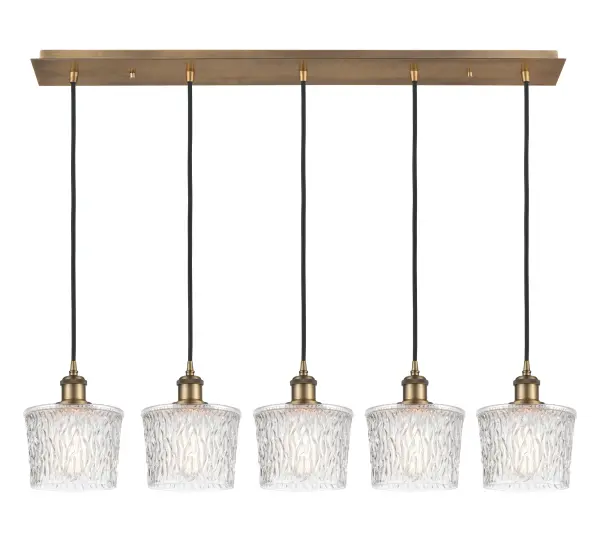 The organic teardrop shape of the Crown Point pendant is artfully hung from a tiered metal frame that is complemented by a single filament bulb. These pendants look great as individual fixtures but make a grand statement when paired with our multi-port hanging system as part of our custom cord program.