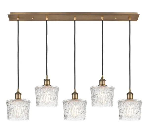 The organic teardrop shape of the Crown Point pendant is artfully hung from a tiered metal frame that is complemented by a single filament bulb. These pendants look great as individual fixtures but make a grand statement when paired with our multi-port hanging system as part of our custom cord program. - alternate view