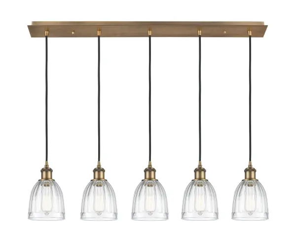 The organic teardrop shape of the Crown Point pendant is artfully hung from a tiered metal frame that is complemented by a single filament bulb. These pendants look great as individual fixtures but make a grand statement when paired with our multi-port hanging system as part of our custom cord program.