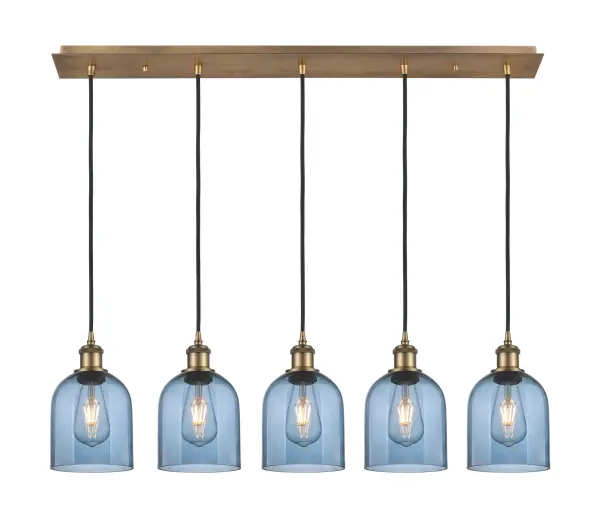The organic teardrop shape of the Crown Point pendant is artfully hung from a tiered metal frame that is complemented by a single filament bulb. These pendants look great as individual fixtures but make a grand statement when paired with our multi-port hanging system as part of our custom cord program.