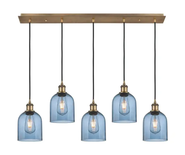 The organic teardrop shape of the Crown Point pendant is artfully hung from a tiered metal frame that is complemented by a single filament bulb. These pendants look great as individual fixtures but make a grand statement when paired with our multi-port hanging system as part of our custom cord program. - alternate view
