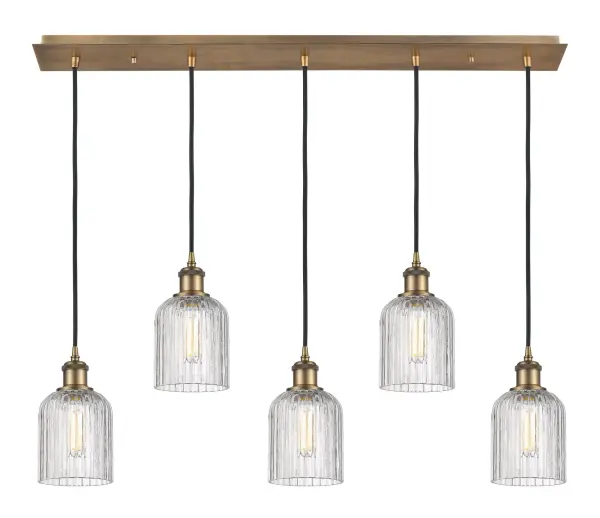 The organic teardrop shape of the Crown Point pendant is artfully hung from a tiered metal frame that is complemented by a single filament bulb. These pendants look great as individual fixtures but make a grand statement when paired with our multi-port hanging system as part of our custom cord program. - alternate view
