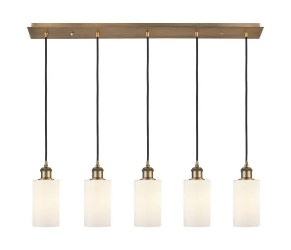 The organic teardrop shape of the Crown Point pendant is artfully hung from a tiered metal frame that is complemented by a single filament bulb. These pendants look great as individual fixtures but make a grand statement when paired with our multi-port hanging system as part of our custom cord program.
