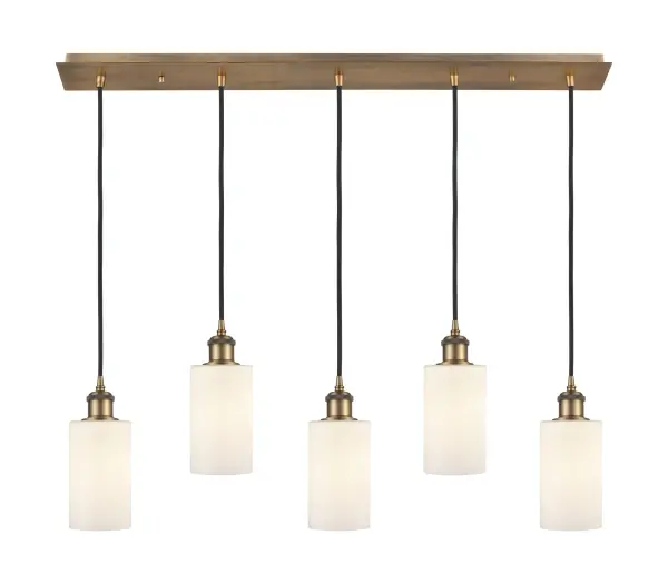 The organic teardrop shape of the Crown Point pendant is artfully hung from a tiered metal frame that is complemented by a single filament bulb. These pendants look great as individual fixtures but make a grand statement when paired with our multi-port hanging system as part of our custom cord program. - alternate view