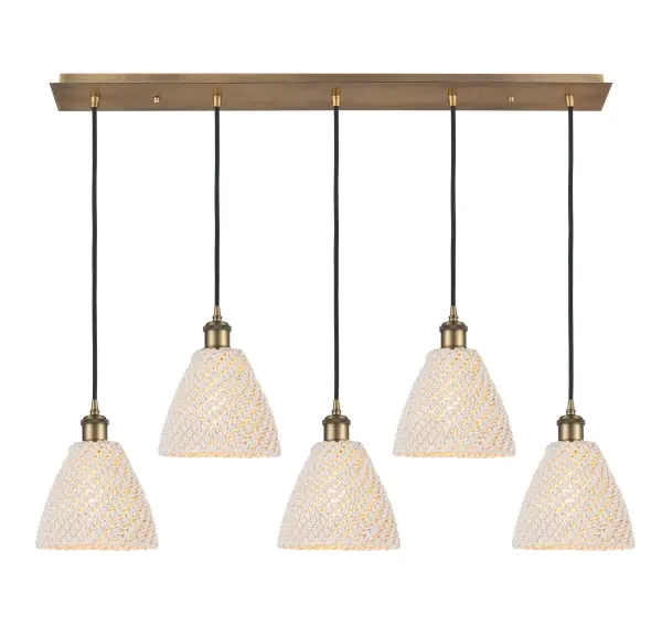 The organic teardrop shape of the Crown Point pendant is artfully hung from a tiered metal frame that is complemented by a single filament bulb. These pendants look great as individual fixtures but make a grand statement when paired with our multi-port hanging system as part of our custom cord program.