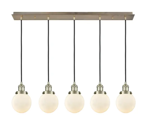 The organic teardrop shape of the Crown Point pendant is artfully hung from a tiered metal frame that is complemented by a single filament bulb. These pendants look great as individual fixtures but make a grand statement when paired with our multi-port hanging system as part of our custom cord program.