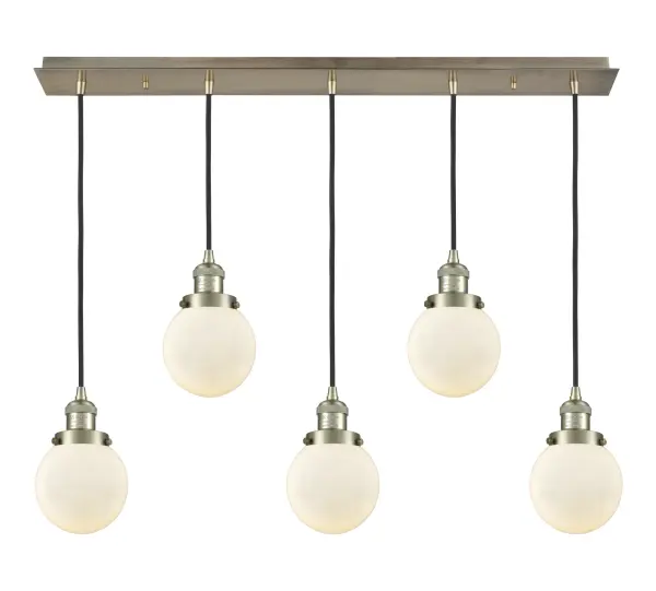The organic teardrop shape of the Crown Point pendant is artfully hung from a tiered metal frame that is complemented by a single filament bulb. These pendants look great as individual fixtures but make a grand statement when paired with our multi-port hanging system as part of our custom cord program. - alternate view