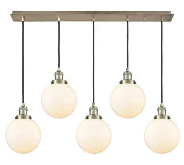 The organic teardrop shape of the Crown Point pendant is artfully hung from a tiered metal frame that is complemented by a single filament bulb. These pendants look great as individual fixtures but make a grand statement when paired with our multi-port hanging system as part of our custom cord program.