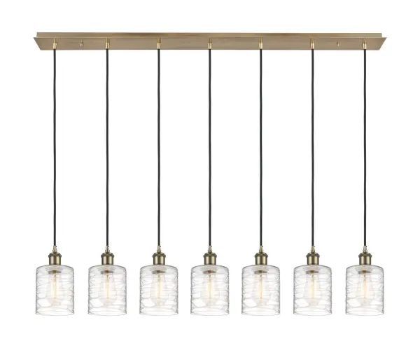 The organic teardrop shape of the Crown Point pendant is artfully hung from a tiered metal frame that is complemented by a single filament bulb. These pendants look great as individual fixtures but make a grand statement when paired with our multi-port hanging system as part of our custom cord program.
