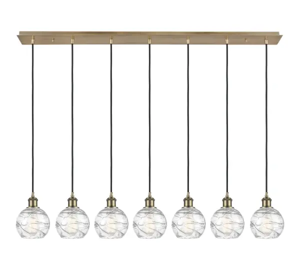 The organic teardrop shape of the Crown Point pendant is artfully hung from a tiered metal frame that is complemented by a single filament bulb. These pendants look great as individual fixtures but make a grand statement when paired with our multi-port hanging system as part of our custom cord program.
