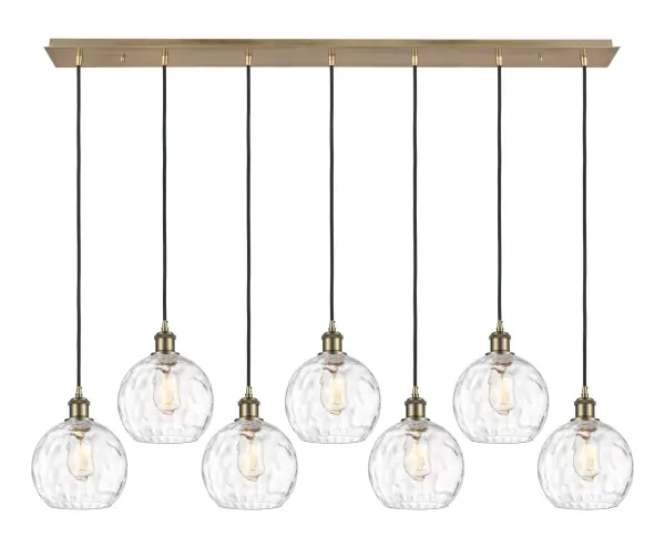 The organic teardrop shape of the Crown Point pendant is artfully hung from a tiered metal frame that is complemented by a single filament bulb. These pendants look great as individual fixtures but make a grand statement when paired with our multi-port hanging system as part of our custom cord program.