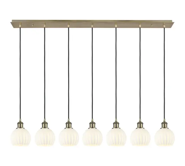 The organic teardrop shape of the Crown Point pendant is artfully hung from a tiered metal frame that is complemented by a single filament bulb. These pendants look great as individual fixtures but make a grand statement when paired with our multi-port hanging system as part of our custom cord program.