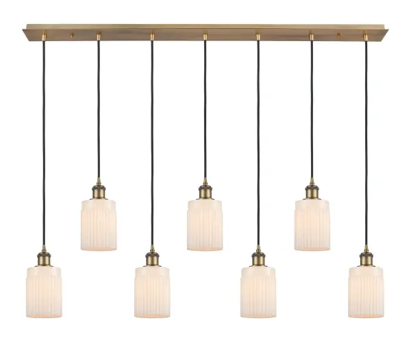 The organic teardrop shape of the Crown Point pendant is artfully hung from a tiered metal frame that is complemented by a single filament bulb. These pendants look great as individual fixtures but make a grand statement when paired with our multi-port hanging system as part of our custom cord program. - alternate view