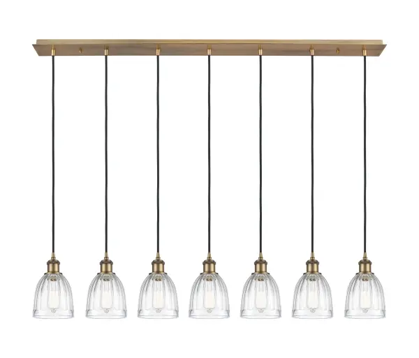 The organic teardrop shape of the Crown Point pendant is artfully hung from a tiered metal frame that is complemented by a single filament bulb. These pendants look great as individual fixtures but make a grand statement when paired with our multi-port hanging system as part of our custom cord program.