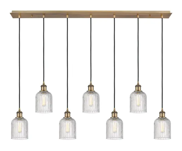 The organic teardrop shape of the Crown Point pendant is artfully hung from a tiered metal frame that is complemented by a single filament bulb. These pendants look great as individual fixtures but make a grand statement when paired with our multi-port hanging system as part of our custom cord program. - alternate view