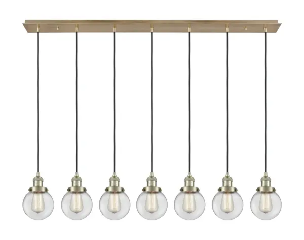 The organic teardrop shape of the Crown Point pendant is artfully hung from a tiered metal frame that is complemented by a single filament bulb. These pendants look great as individual fixtures but make a grand statement when paired with our multi-port hanging system as part of our custom cord program.