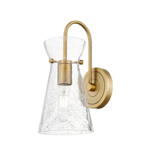 The Nicole is a modern industrial collection that incorporates exceptional architectural details and an equally striking cone shaped shade. The geometric shape of the glass or metal shade give this collection a charming and timeless presence. For a bathroom  light choice that stands out, look no further than the Nicole sconce.