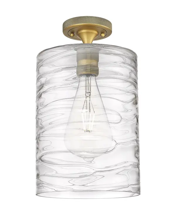 Details abound in the Crown Point Collection with an industrial take on modern sophistication. This stunning line of fixtures features cylindrical glass set in an updated restoration style frame with intricate knurling detail on the sockets, canopy, and finials.