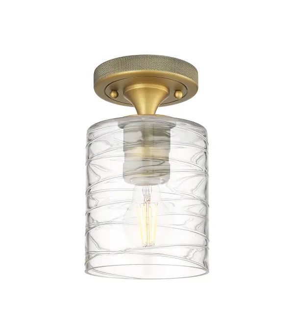 Details abound in the Crown Point Collection with an industrial take on modern sophistication. This stunning line of fixtures features cylindrical glass set in an updated restoration style frame with intricate knurling detail on the sockets, canopy, and finials.