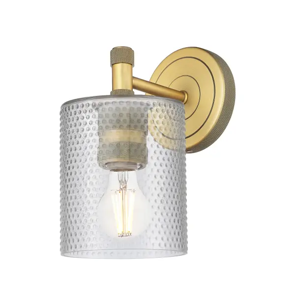 Details abound in the Crown Point Collection with an industrial take on modern sophistication. This stunning line of fixtures features cylindrical glass set in an updated restoration style frame with intricate knurling detail on the sockets, canopy, and finials.