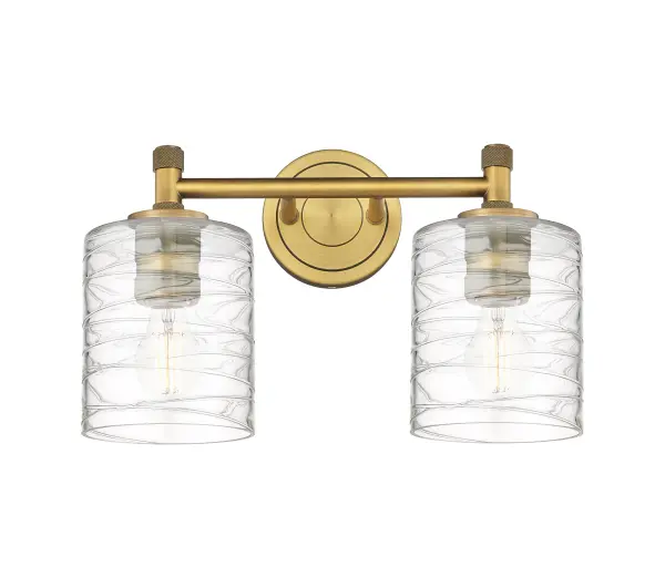 Details abound in the Crown Point Collection with an industrial take on modern sophistication. This stunning line of fixtures features cylindrical glass set in an updated restoration style frame with intricate knurling detail on the sockets, canopy, and finials.