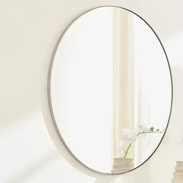 This 36-inch round mirror features a sleek silver finish that complements any décor style. Its generous size makes it ideal for bathrooms, bedrooms, and entryways, while the simple, clean design ensures timeless appeal. - alternate view