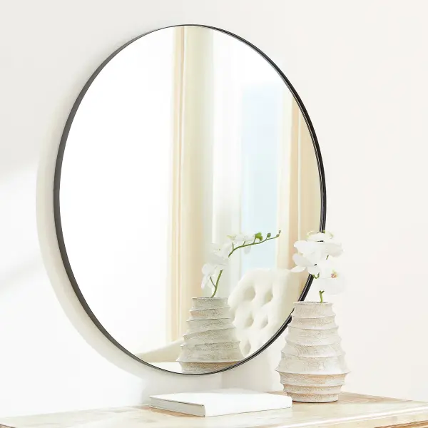 This 42-inch round mirror features a sleek matte black frame that complements any modern or contemporary décor. Its generous size makes it ideal for bathrooms, bedrooms, and entryways while maintaining a minimalist aesthetic. - alternate view