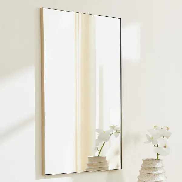 This 24x36" rectangular mirror offers a timeless design with a sleek silver frame that complements any décor style. Its medium size makes it ideal for bathrooms, bedrooms, and entryways, providing both function and style. - alternate view