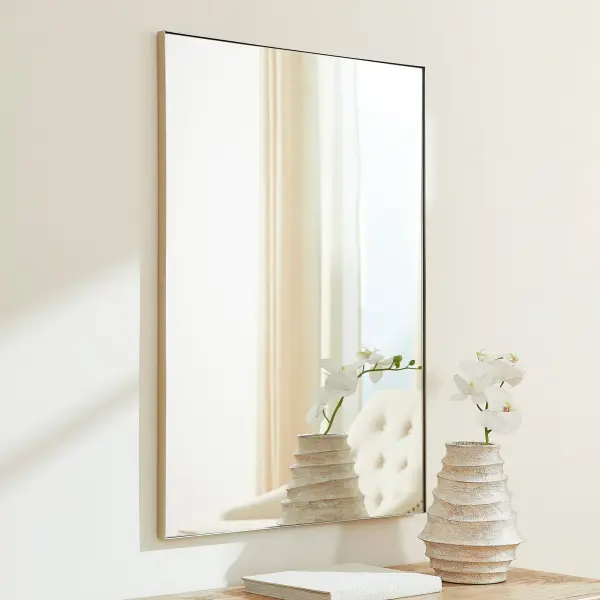This 30x40" rectangular mirror offers a clean, minimalist aesthetic with a silver frame that complements any décor. Its generous size makes it ideal for bathrooms, bedrooms, and entryways, providing both function and style. - alternate view