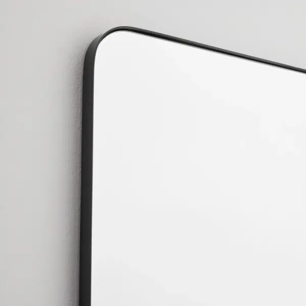 The Stadium mirror combines contemporary design with practical functionality. Its rounded rectangle shape and 1-inch frame extension create visual interest while the matte black finish adds sophistication to any space. - alternate view