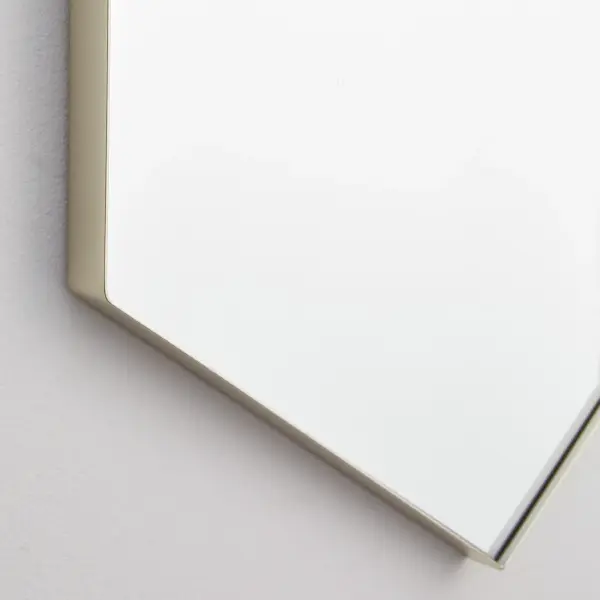 This 24"x34" hexagonal mirror combines contemporary geometric styling with practical functionality. The 1-inch frame extension in silver finish adds subtle dimension while maintaining versatility across interior styles. - alternate view