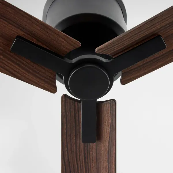 The Osprey 56" combines 19th-century revival charm with modern wet-rated performance. Its hugger mount design makes it ideal for low ceilings while the matte black finish adds industrial sophistication to covered outdoor spaces. - alternate view
