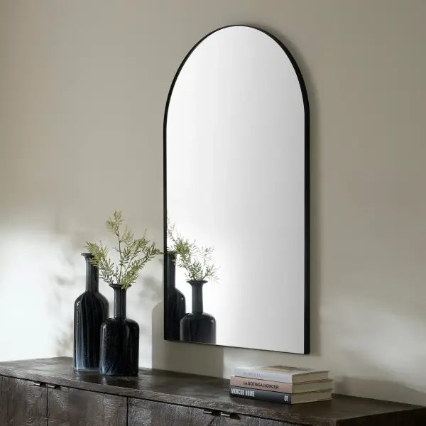 This 29"x46" arched mirror combines contemporary design with practical functionality. The 1-inch frame extension in matte black finish adds depth and sophistication to any space while remaining versatile enough for residential or commercial use. - alternate view