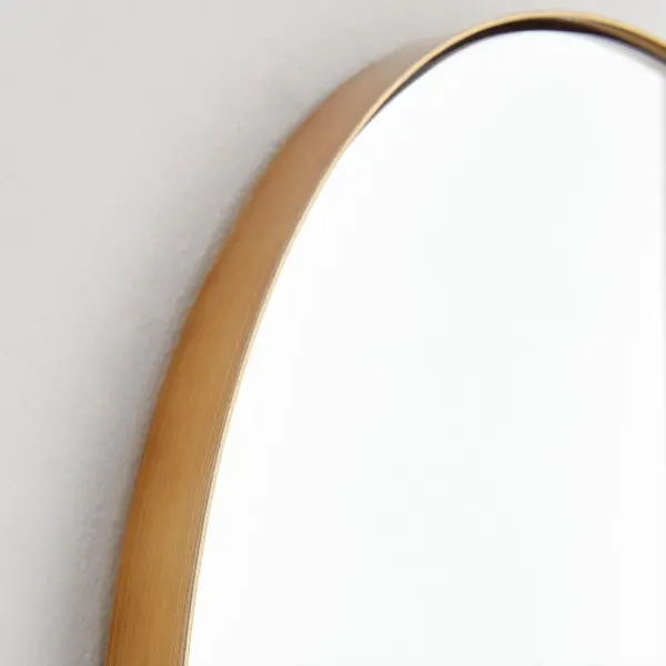 The Capsule mirror brings contemporary sophistication with its distinctive pill-shaped contour and warm gold finish. At 21" x 40", it's perfectly sized for bathrooms, bedrooms, and entryways, offering both function and style. - alternate view