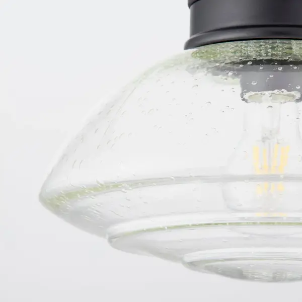 The Windmill Clear Seeded Light Kit brings weathered industrial design with a modern twist. Its clear seeded glass shade refracts light with a soft, nostalgic shimmer, creating rustic allure perfect for transitional spaces. - alternate view