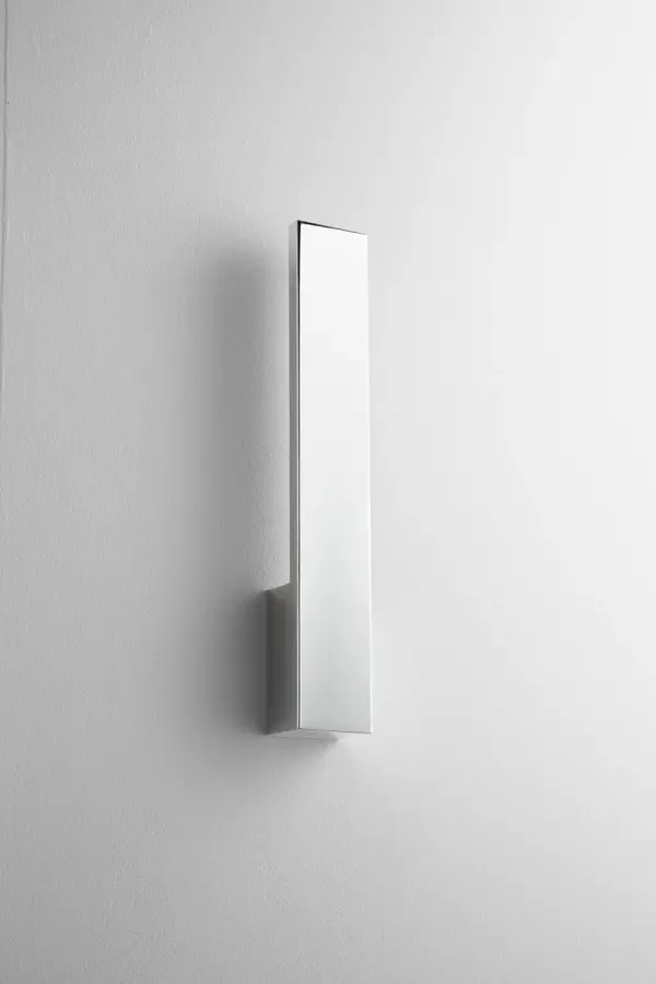 This contemporary wall sconce delivers impressive 1475-lumen output in a compact 19.5-inch profile. The polished chrome finish and matte white glass create a clean, modern aesthetic perfect for task or ambient lighting.