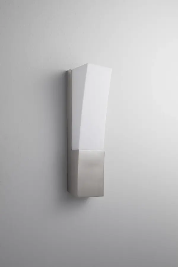 The Crescent LED sconce delivers impressive 1218-lumen output in a compact 14-inch profile. Its satin nickel finish and matte white diffuser create soft, even illumination ideal for task and ambient lighting in contemporary spaces.