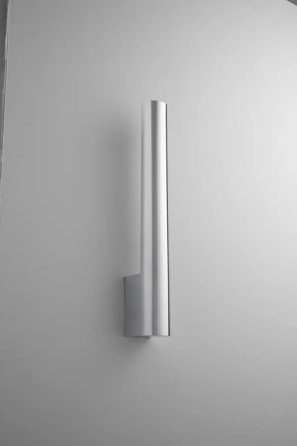 The Mies LED Wall Sconce delivers modern minimalism with integrated LED technology. Its polished chrome finish and matte white diffuser create clean, functional lighting ideal for contemporary bathrooms and hallways.