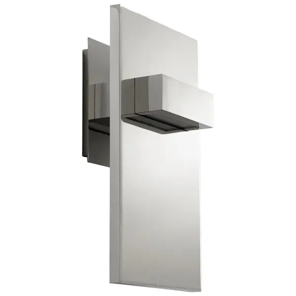 The Vela LED sconce combines contemporary styling with integrated LED technology. Its compact 6.88" width and polished nickel finish make it ideal for modern bathrooms and hallways where clean lines and efficient lighting are priorities.