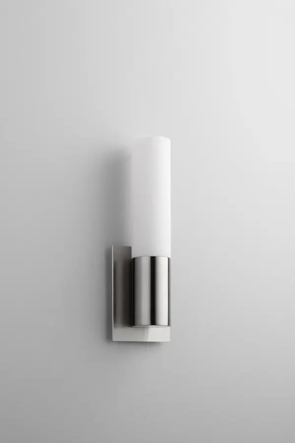 The Magneta LED sconce delivers modern efficiency in a compact profile. Its integrated LED provides warm 3000K light with excellent color rendering, while the satin nickel finish and opal glass create a refined, versatile look.