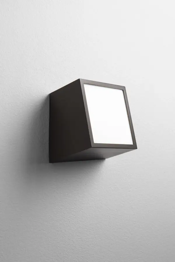 The Zeta LED Wall Sconce delivers efficient, maintenance-free lighting in a compact profile. Its integrated LED provides warm 3000K light with excellent color rendering, while the oiled bronze finish and matte white shade create a clean, contemporary look suitable for various residential and commercial settings.