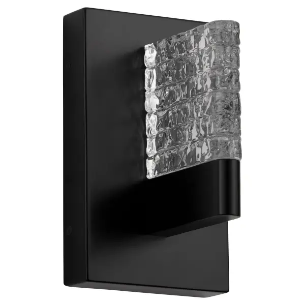 The Gamma LED sconce brings modernist design principles to life with its stacked frost white glass diffuser and sleek black frame. Compact at under 9 inches tall, it delivers warm 2700K LED light ideal for intimate spaces.