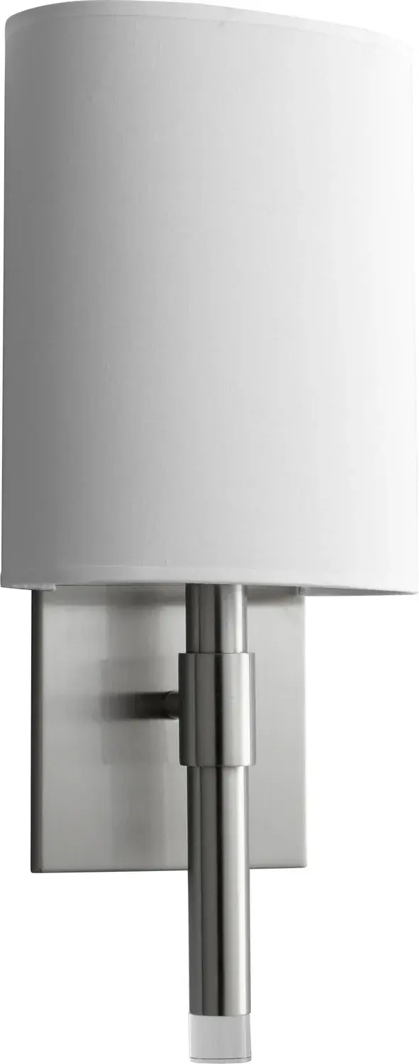 The BEACON LED sconce combines energy-efficient integrated LED technology with a soft white linen shade for warm, diffused lighting. Its compact 7-inch width and satin nickel finish make it ideal for contemporary bathrooms and hallways.